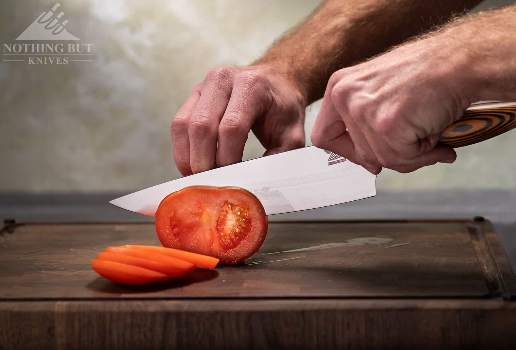 The BigSunny 8 inch chef knife effortlessly sliced tomatoes and other vegetables. It is an excellent budget chef knife.