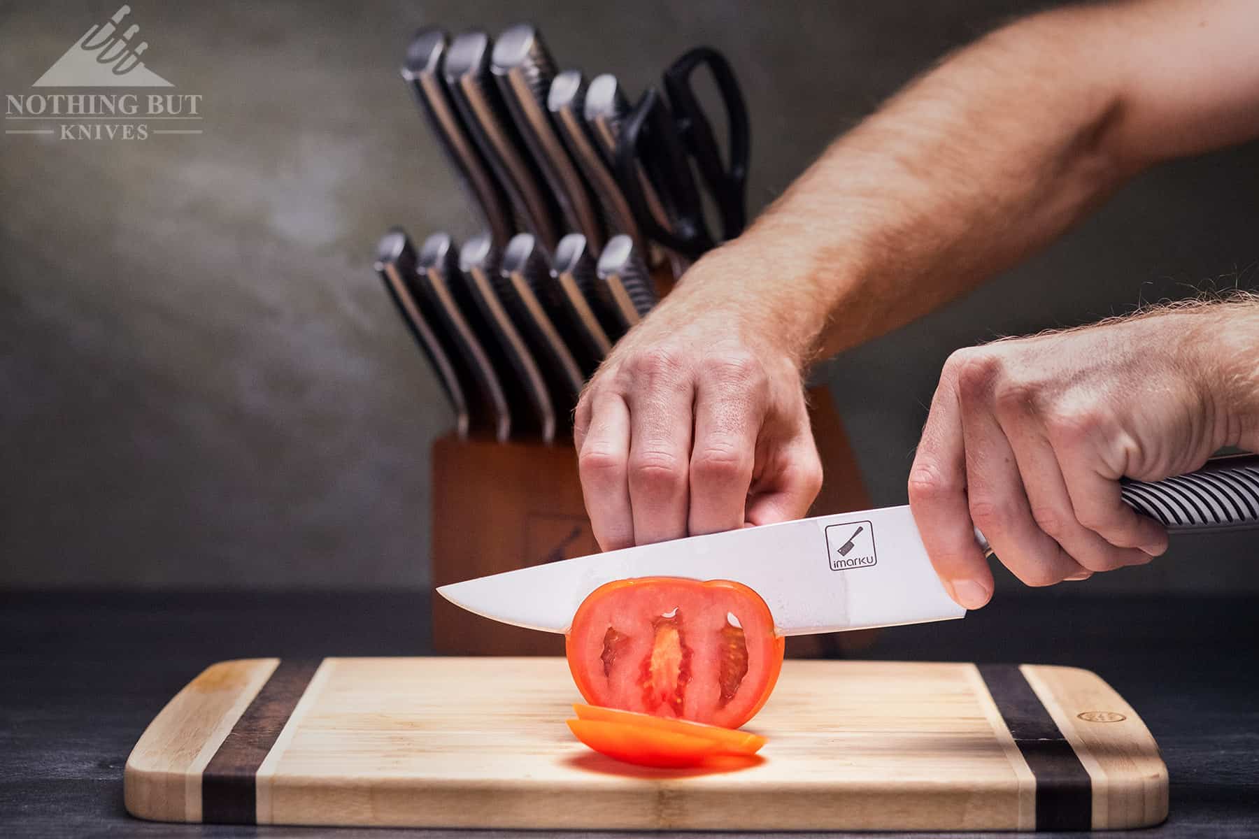 Effortlessly slicing a tomato with the Imarku chef knife for meal prep .