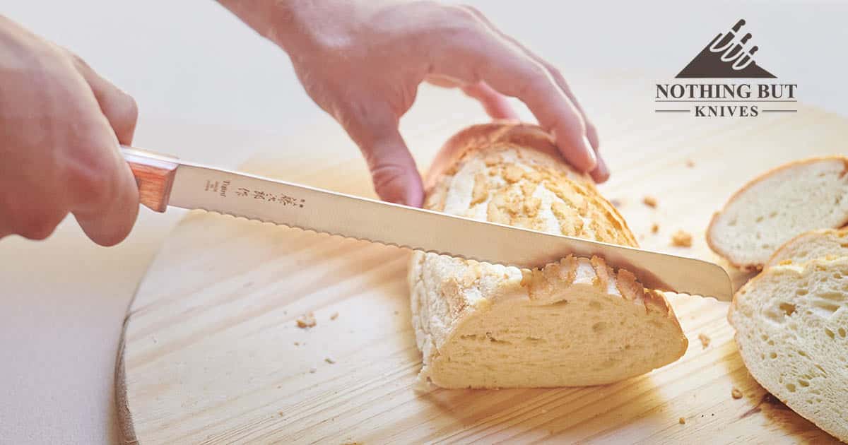 Tojiro Bread Slicer 235Mm F-737 Review - Image 2 Slicing a loaf of bread with the Tojiro Bread Knife