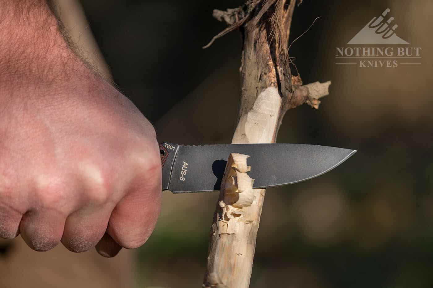 Cima G20 Fixed Blade Knife feathering a dry stick.