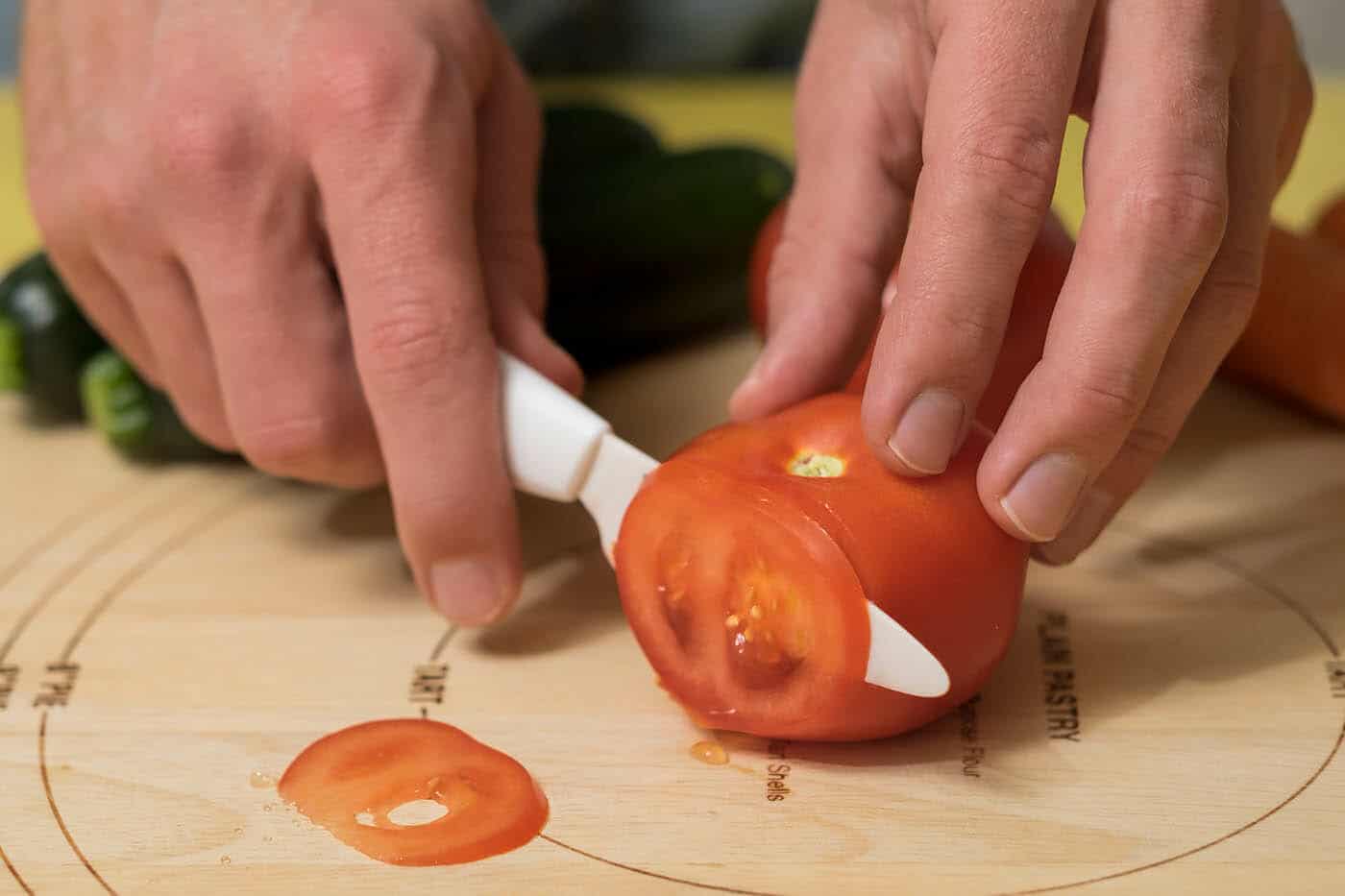 Kyocera Ceramic Revolution Series Paring Knife Review - Image 2 Slicing through a tomato was no problem for the Kyocera paring knife.
