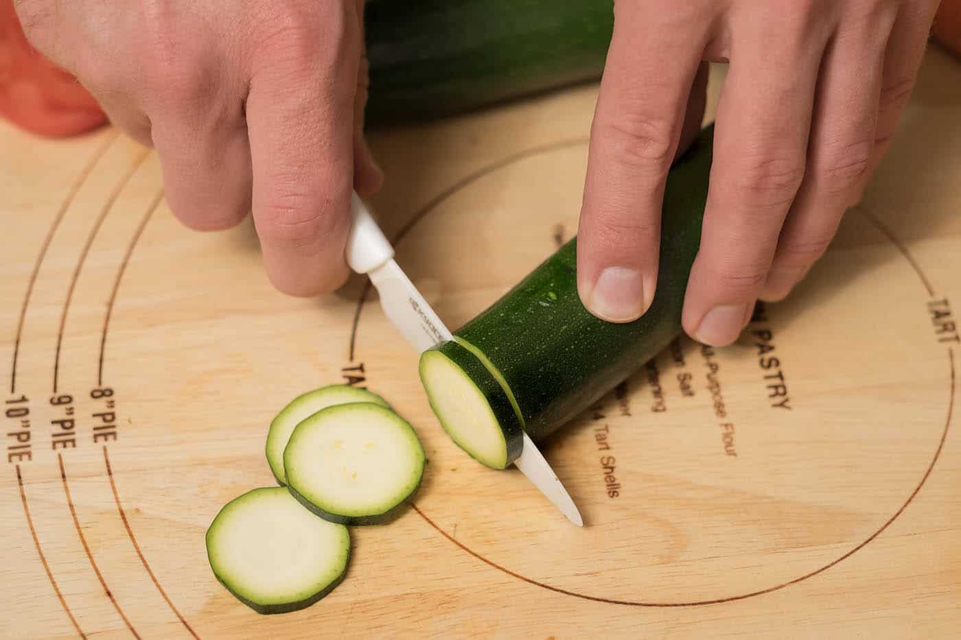 Kyocera Ceramic Revolution Series Paring Knife Review - Image 3 Cutting through a zuchini with ease using the Kyocera paring knife.
