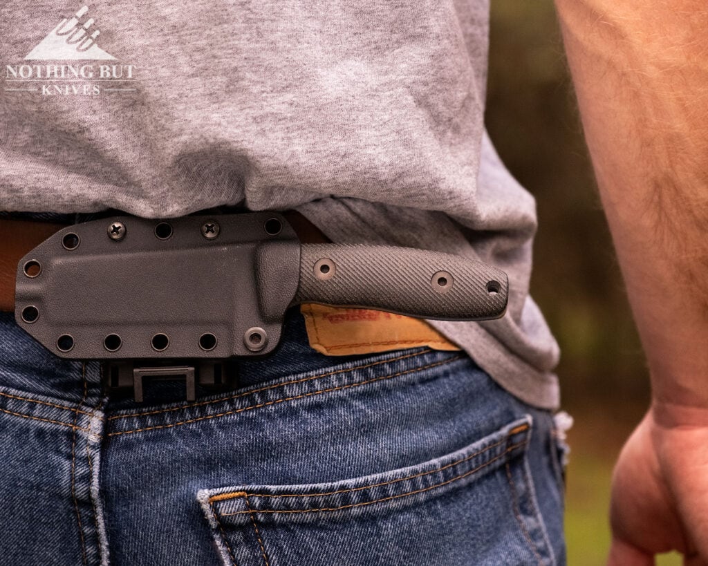 Best Horizontal Carry Knives - Continuous Update - Image 22 A close-up of the Reiff Circadian knife in its kydex sheath in the scout carry position on a person's belt.