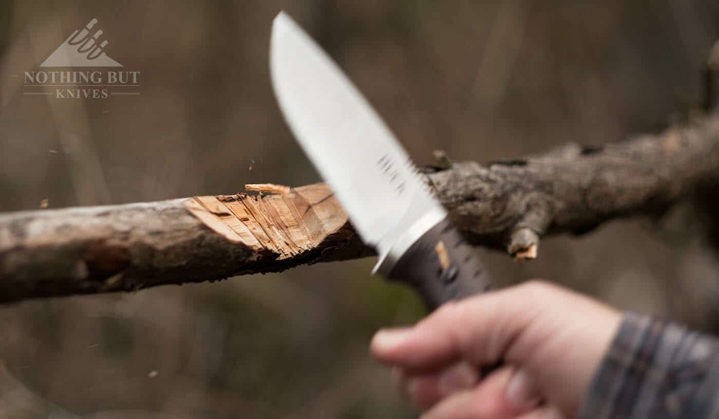 Buck Selkirk Knife Review - Image 8 The Selkirk chopping through a branch about two inches thick.