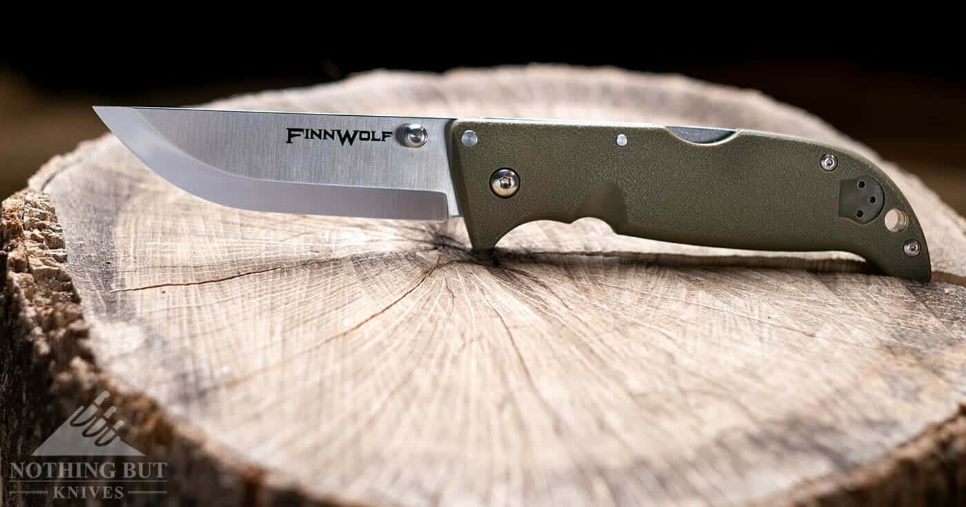 The Cold Steel Finn Wolf hard use knife with an OD green handle. 