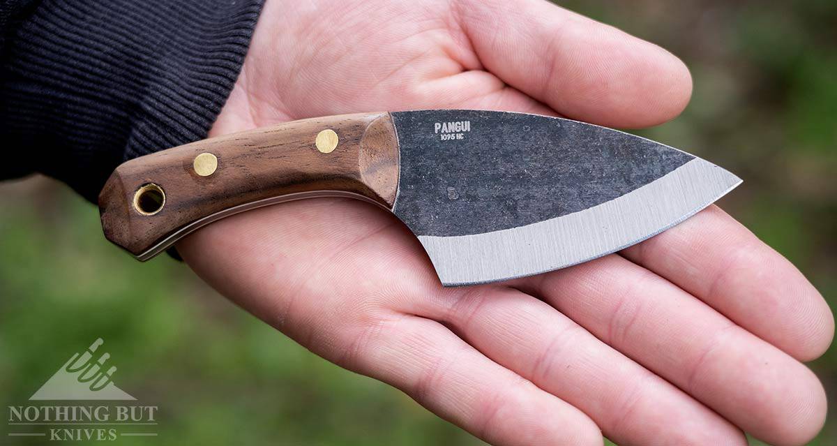 The Condor Pangui neck knife in a man's hand to show scale.