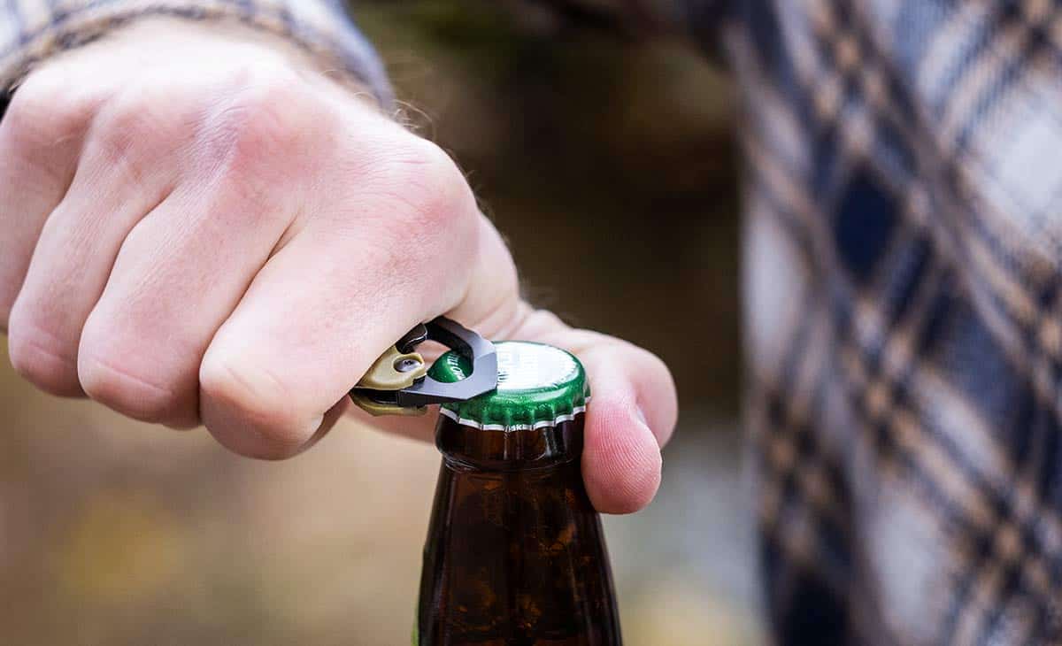 Best Hard Use Pocket Knives Under $50 And $100 - Image 12 The Kershaw Shuffle ll is a durable pocket knife that has a bottle opener built in to the handle.