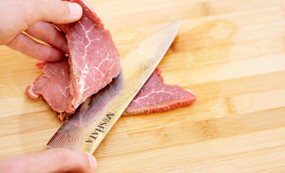 Slicing steak with this chef knife was fairly easy, but not as easy as it would be with a high end knife. 