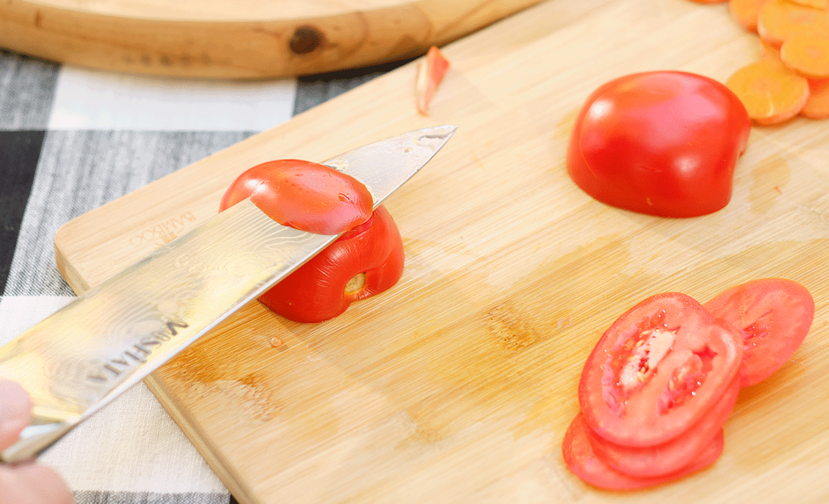 Mosfiata 8-Inch Chef Knife Review - Image 2 The Mosfiata chef knife made it easy to slice a tomato one handed.