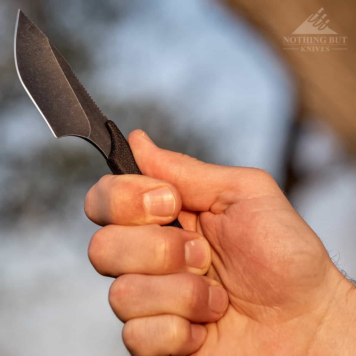 Outdoor Edge Le Duck Knife Review - Image 6 Hand cjoked back on the butt of the Le Duck handle.