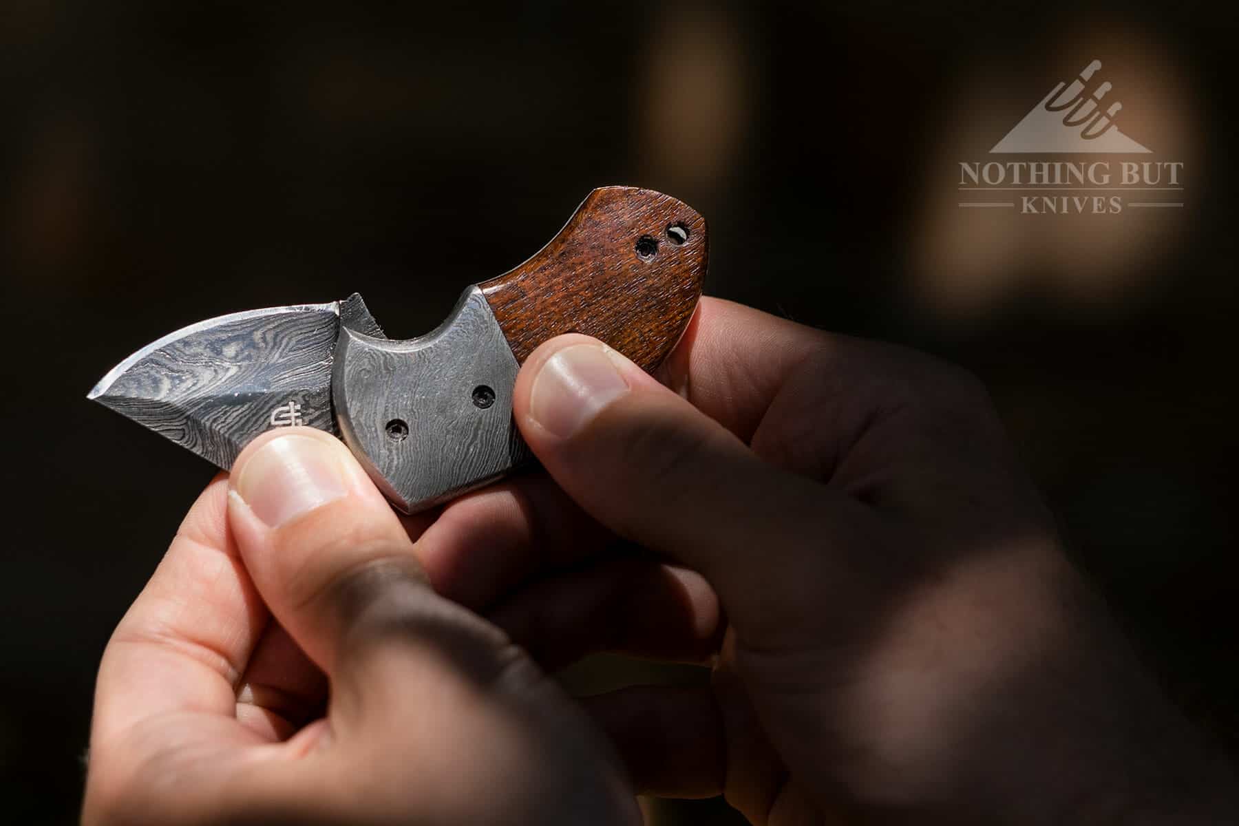 Opening the Lightoller folding knife with two hands. 