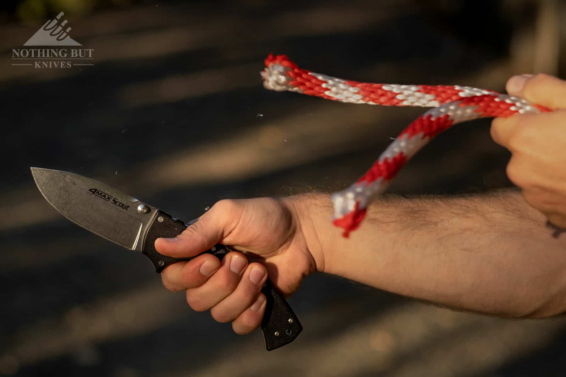 This knife cuts through rope easily and holds it's edge well. 