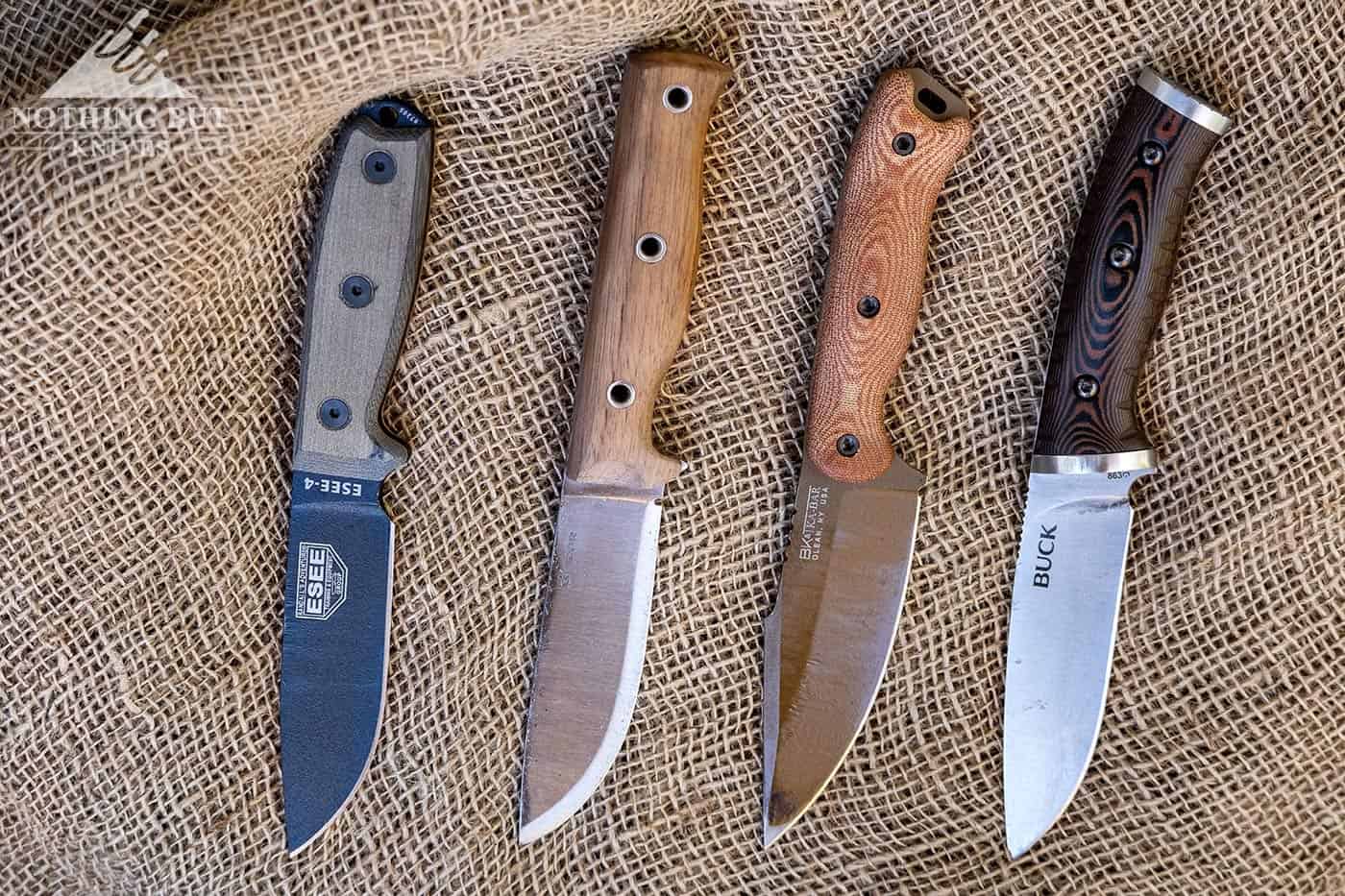 The Esee 4, Buck Selkirk, Condor Swamp Romper and Ka-bar Becker BK18 Harpoon on burlap.