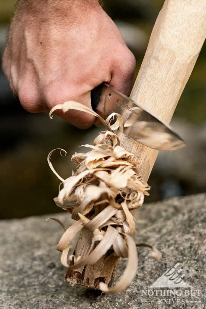 Spyderco Bill Moran Fixed Blade Review - Image 1 The Spyderco Bill Moran making a feather stick to start a fire with a ferro rod.