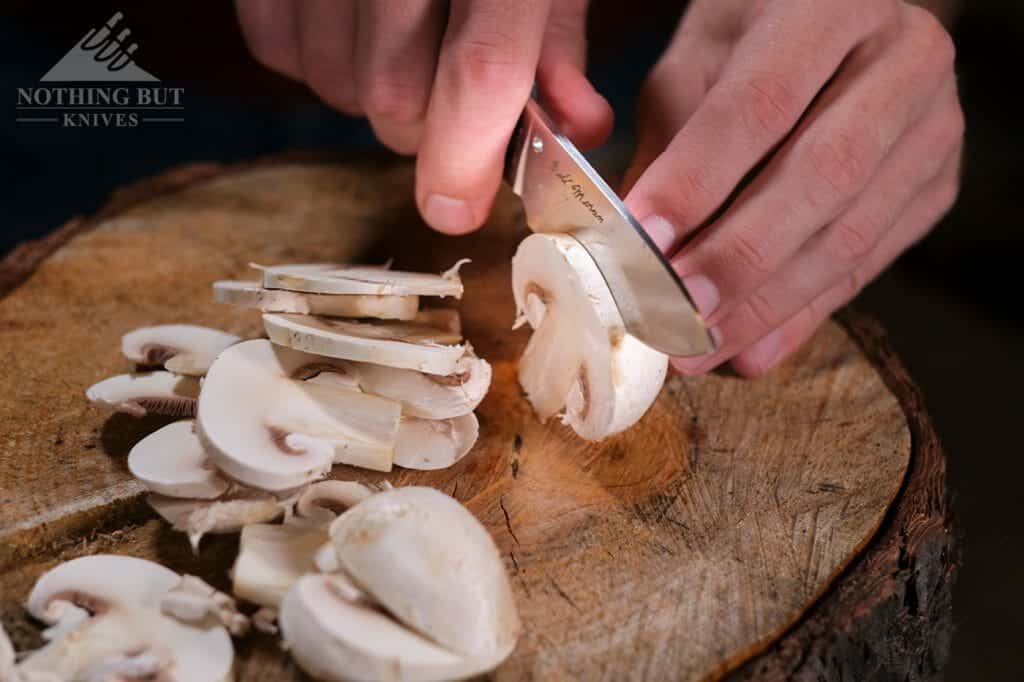 This knife works on food better than most of my kitchen knives. This image shows how easily and quickly it slices mushrooms. 