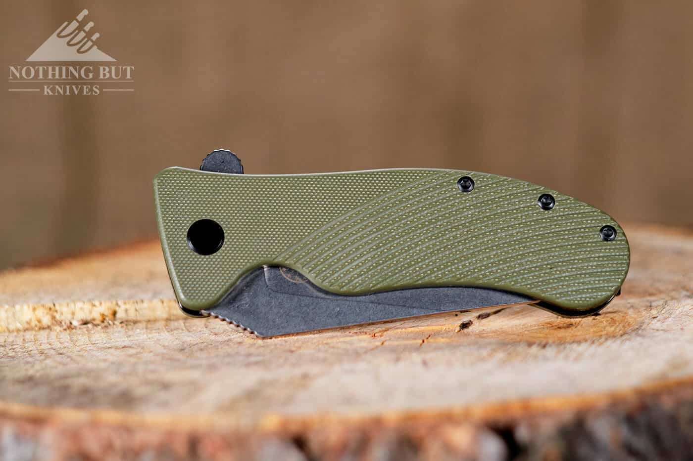 Off-Grid Rhino Review - V2 Update - Image 2 The Off-Grid Rhino sitting on a tree stump in the closed position.