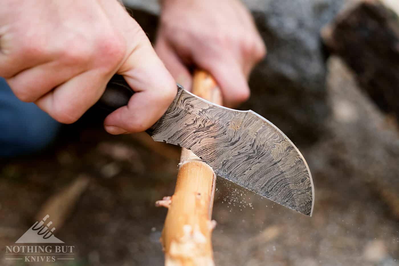 Forseti Steel Ironside Damascus Tracker Review - Image 18 Making a notch in wood with the Forseti Steel Ironside Tracker Survival knife.