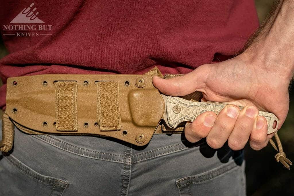 The Buck Knives Ground Combat Knife being drawn from it's horizontal carry sheath. 
