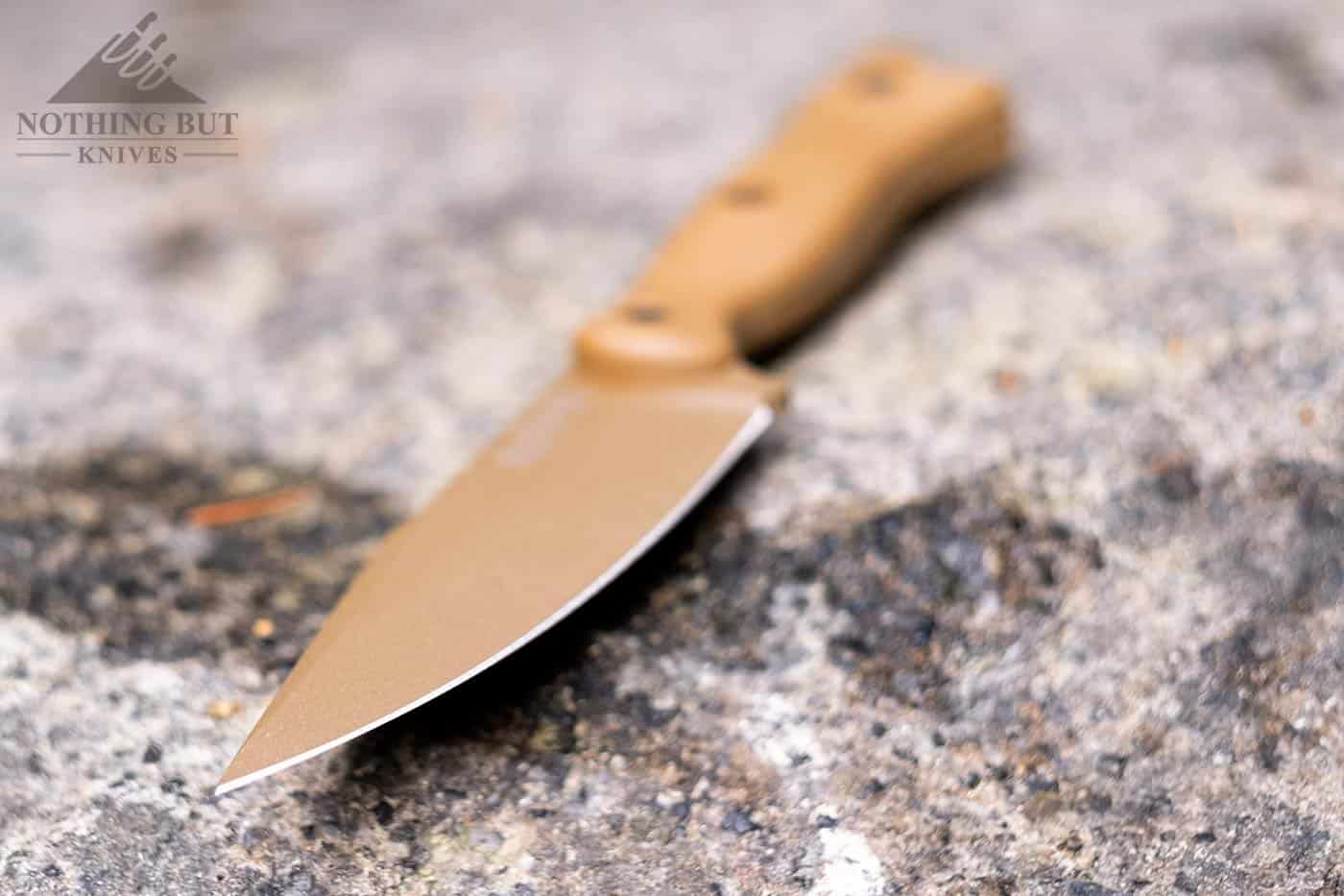 A shallow depth of field image highlighting the blade of the Ka-Bar Harpoon knife.