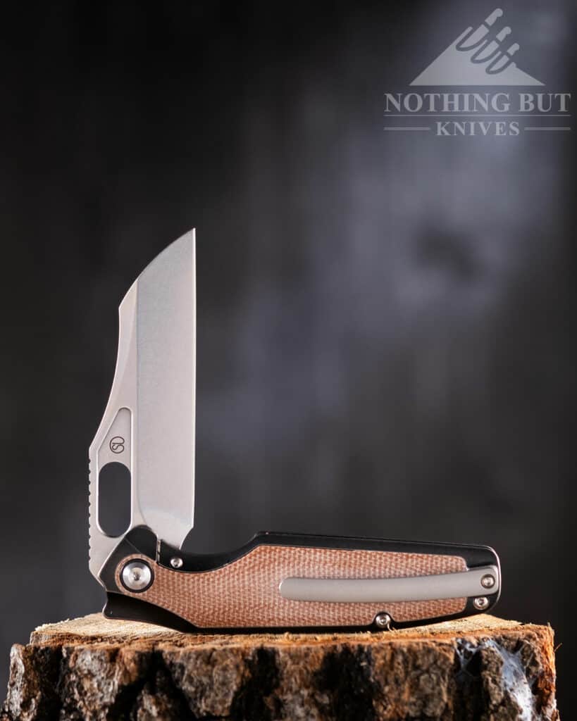 This folding knife features a CPM 20V blade and a titanium handle. 