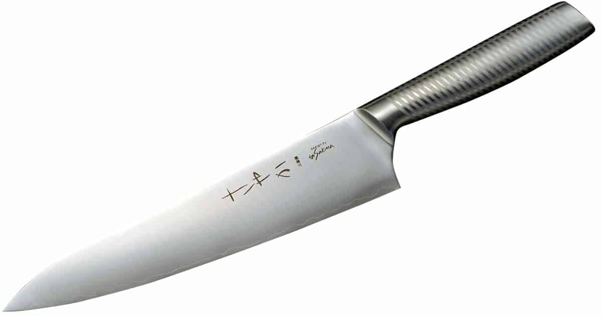 The Yaxell Sayaka 8 inch chef knife with a metal handle on a white background. 
