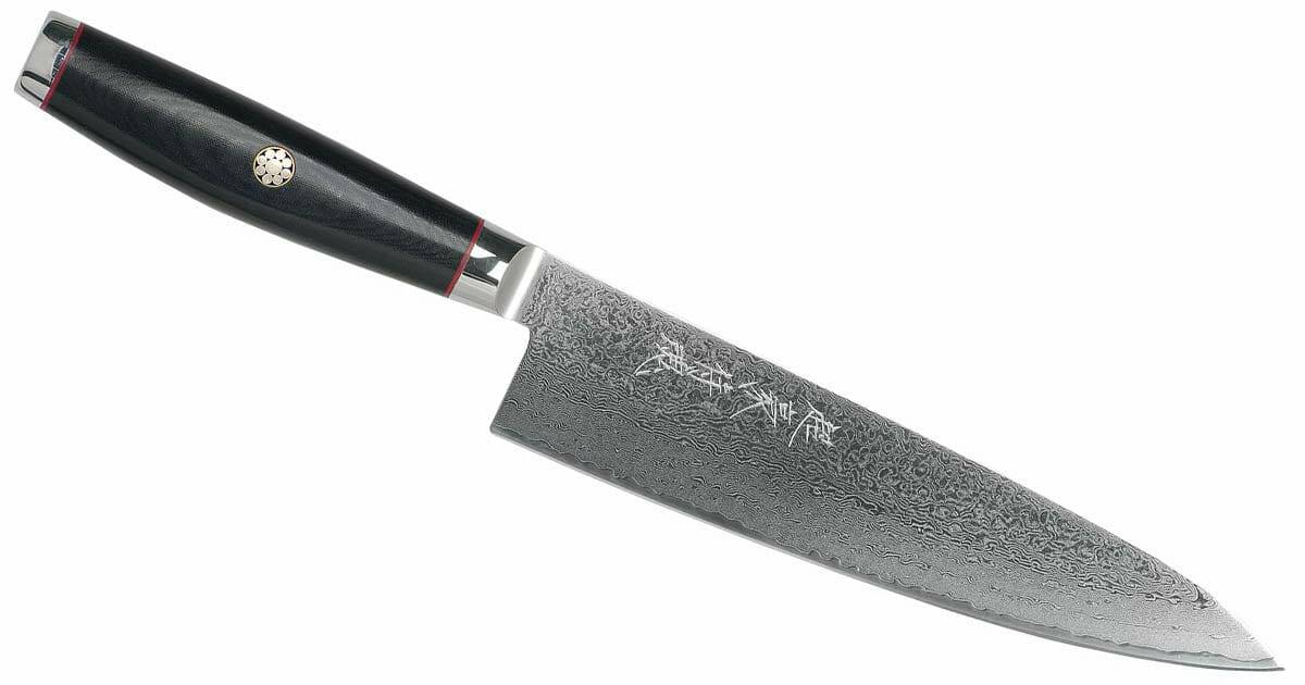 The Yazell Super Gou 200mm chef knife with micarta handle and Damascus steel blade. 
