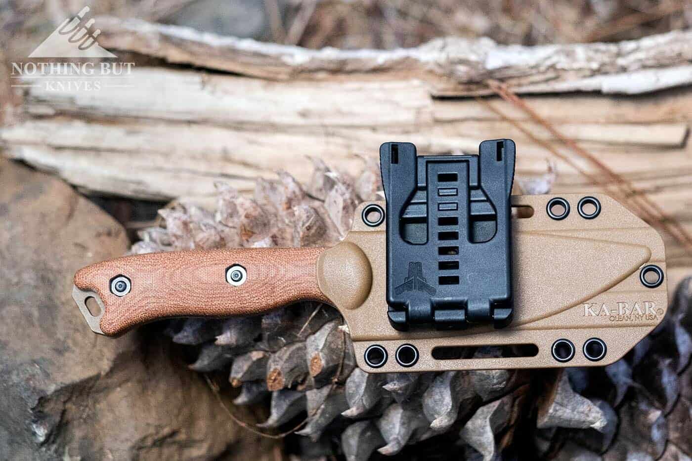 The Tek-Lok attached to the Ka-Bar Becker knife sheath so it can be carried in the horizontal position.