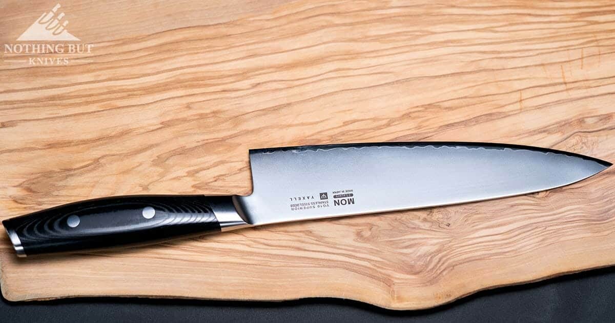 A Yaxell chef knife profile shot that dhows the quality of the fit and finish. 