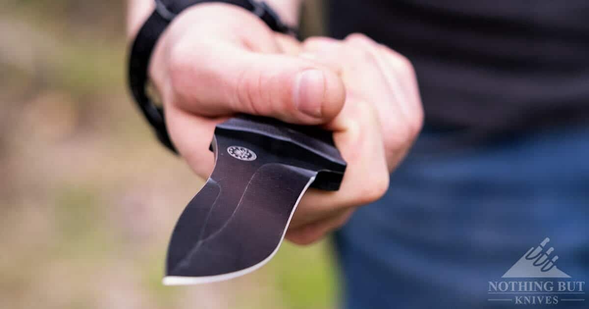 A close-up of the Off-Grid Backcountry Blackout in a man's hand. 