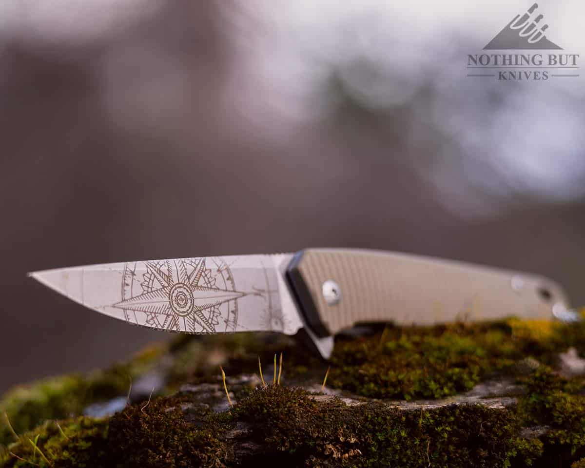 Shallow depth of field image of the 3V Gear knife blade.