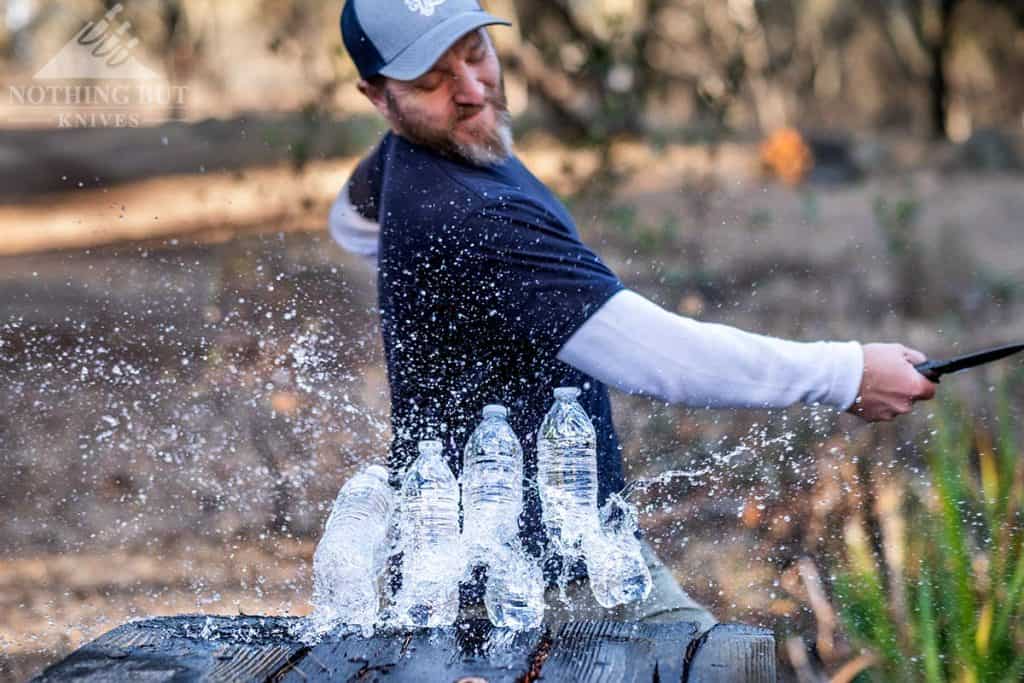 Slicing four water bottles with the LionSteel T5 tactical survival knife. 