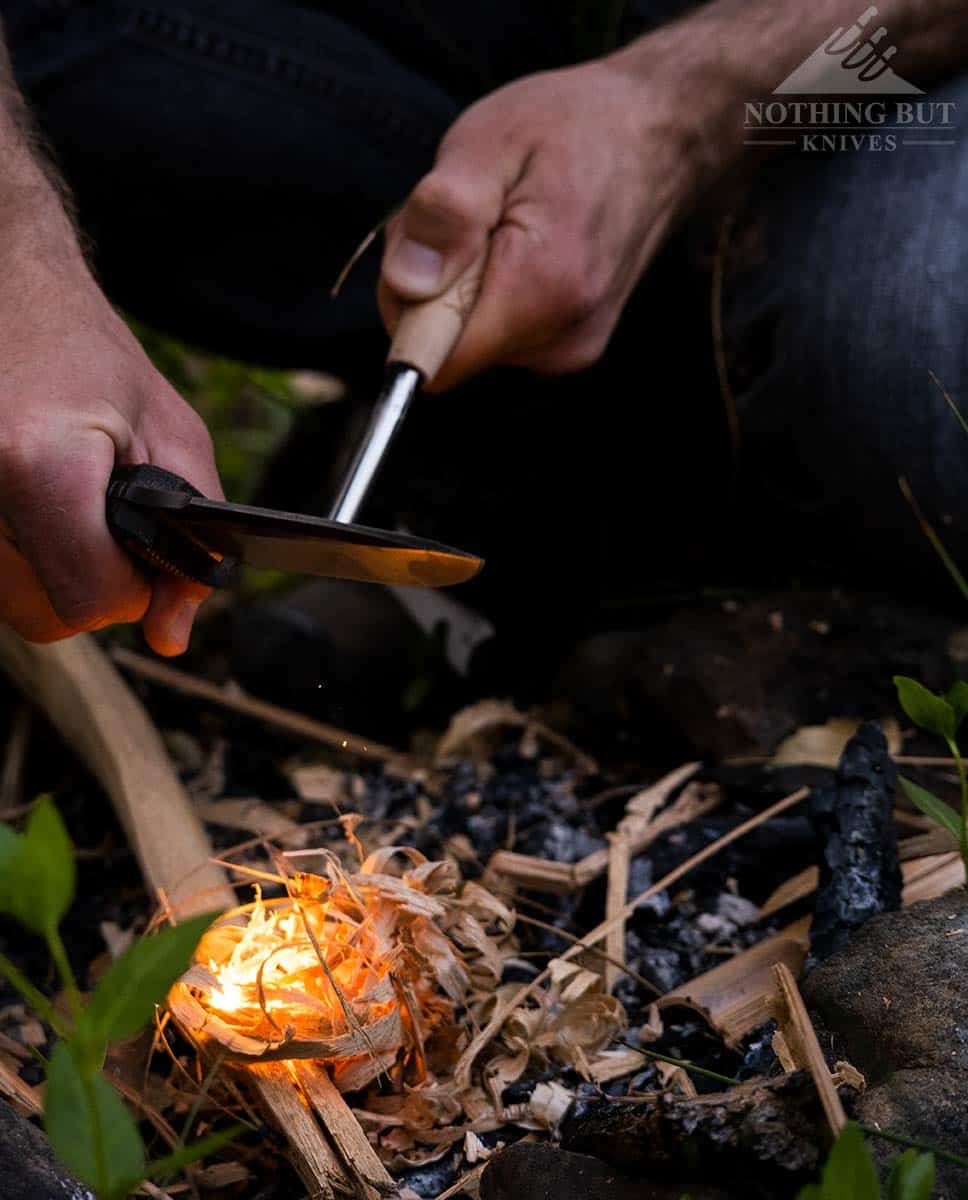 The lionSteel T5 starting a campfire with a ferro rod.
