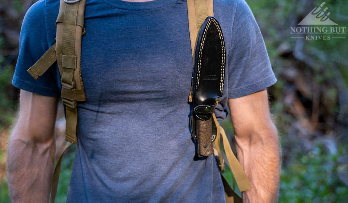 The T5 fixed blade knife upside sown on a backpack with the MOLLE attachment.