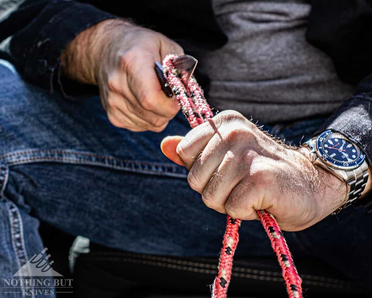 Buck 841 Sprint Pro Review - Image 10 The blade of the Buck Sprint Pro about to slice through rope.