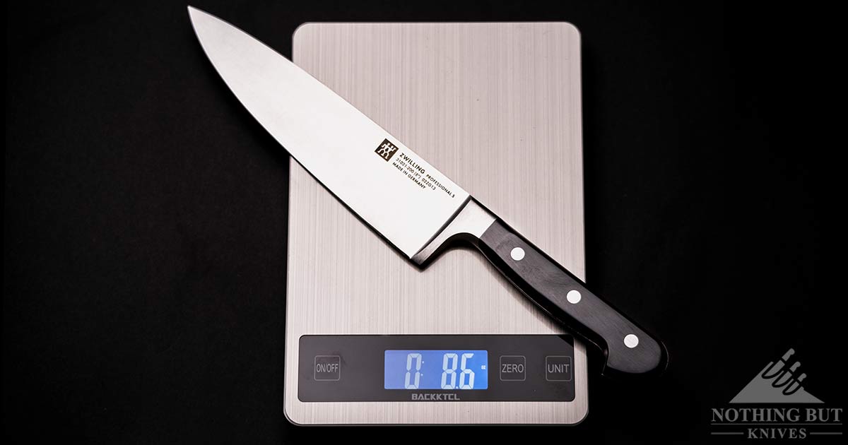 Professional S chef knife on a digital scale .