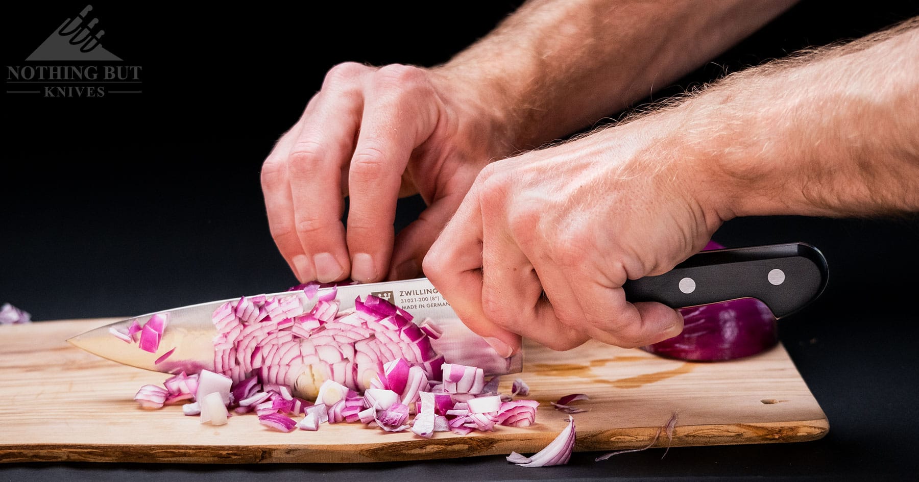 The Zwilling Professional S chef knife is a tough slicer, but it is a bit too heavy by modern standards.