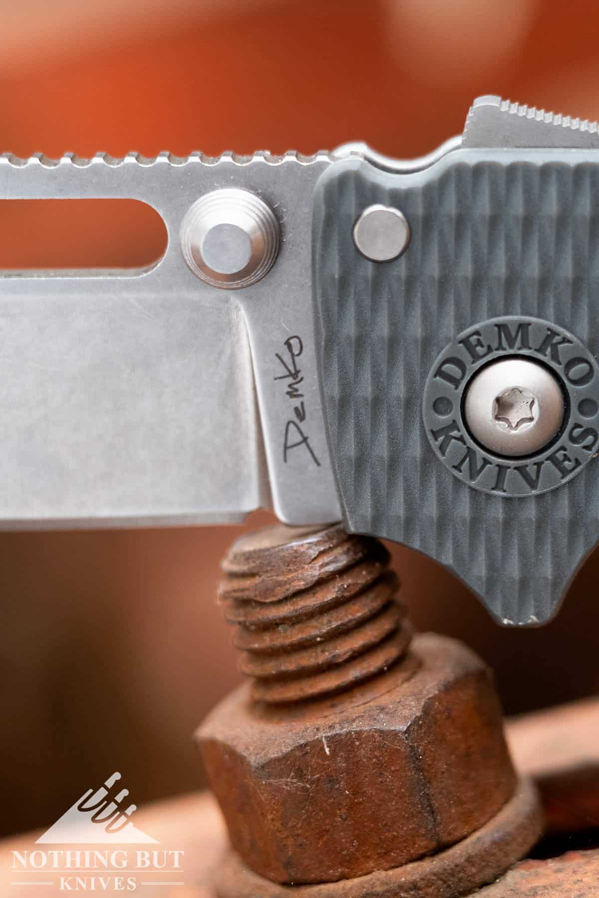 Close-up of the Demko AD 20.5 Shark Lock and thumb stud. 