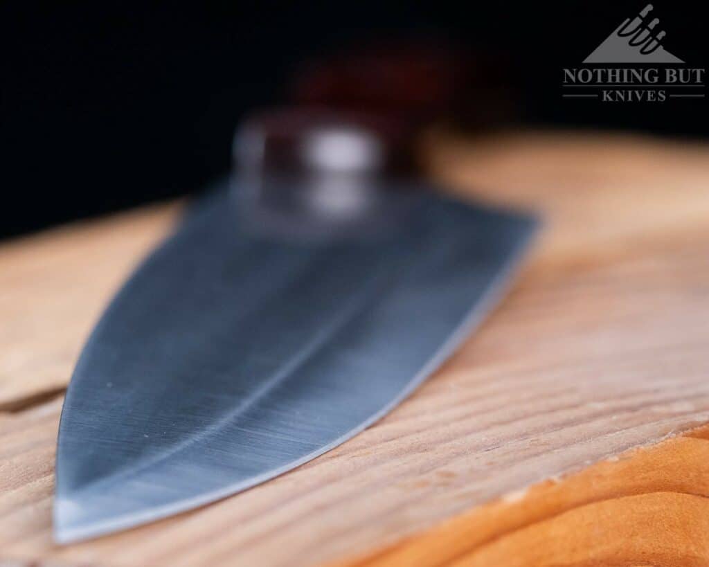 The hollow grind edge of the Buck 8 inch chef knife does role fairly easy, but it is easily fixed with a honing rod.