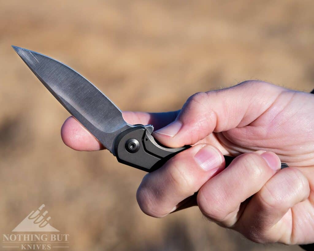 Civivi Nox Review - Image 8 A person's hand pushing open the frame lock on the Nox to close the blade.