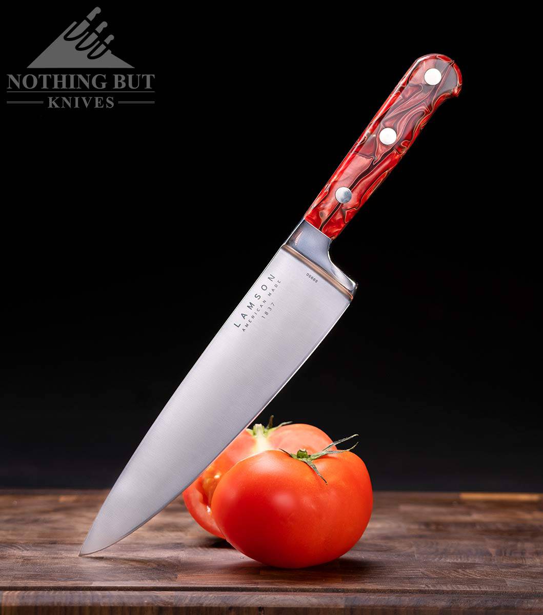 The Lamson 8 inch Premier chef knife is a decent alternative to the Buck 931. It is pictured here with a sliced tomato on a cutting board. 