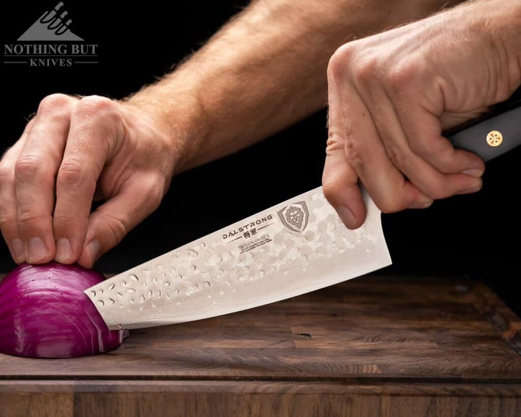 Dalstrong Shogun Series X Chef Knife Review - Image 6 The tip of the Shogun Series X chef knife is angled down which helps when slicing onions.