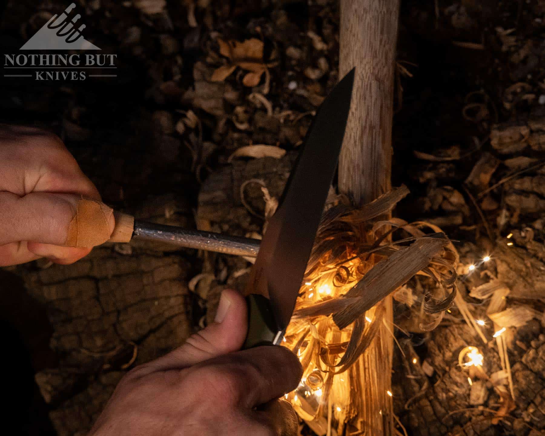 Throwing spark onto a firestick with a ferro rod using the jimping on the spine of the Kepler.