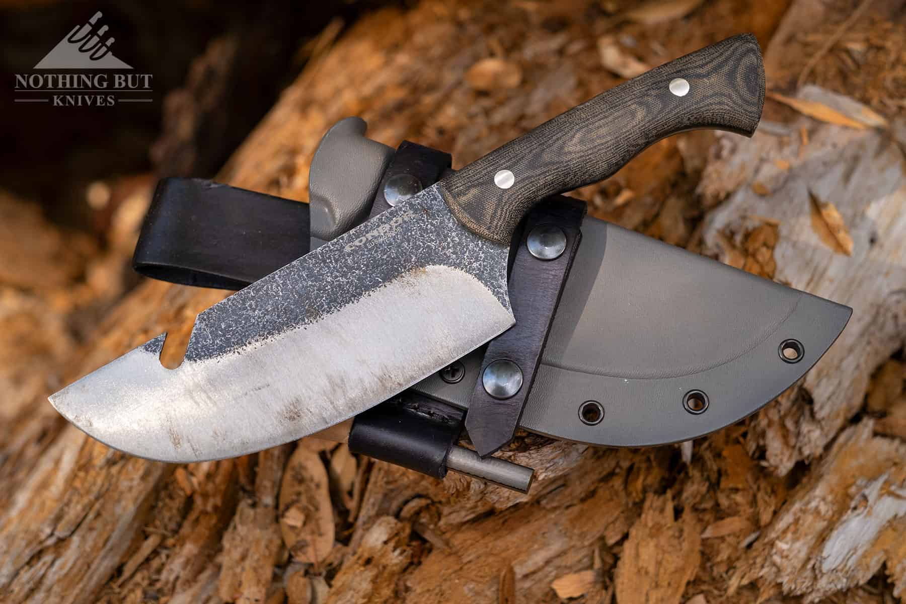 The Condor Bush Slicer shown with it's kydex sheath, so the viewer can see the differences from the Plan A Bowie.