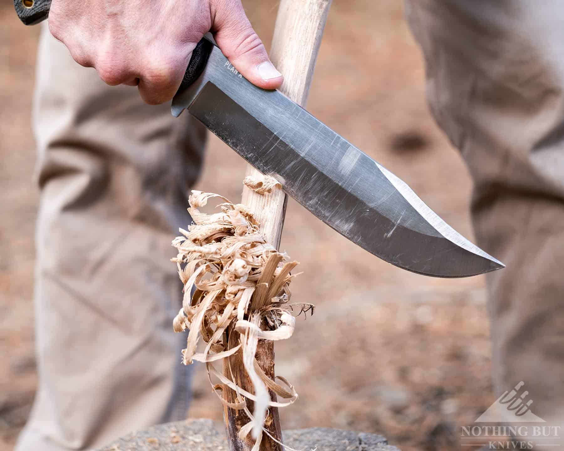 Condor Bowie knife in the process of feather sticking. This image shows that this knife is capable of  making a usable feather stick.