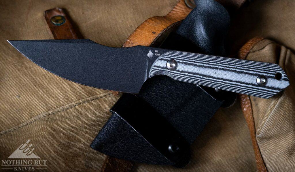 The Kizer Harpoon fixed blade knife is a horizontal carry only knife.  It is pictured here on a retro Army backpack. 