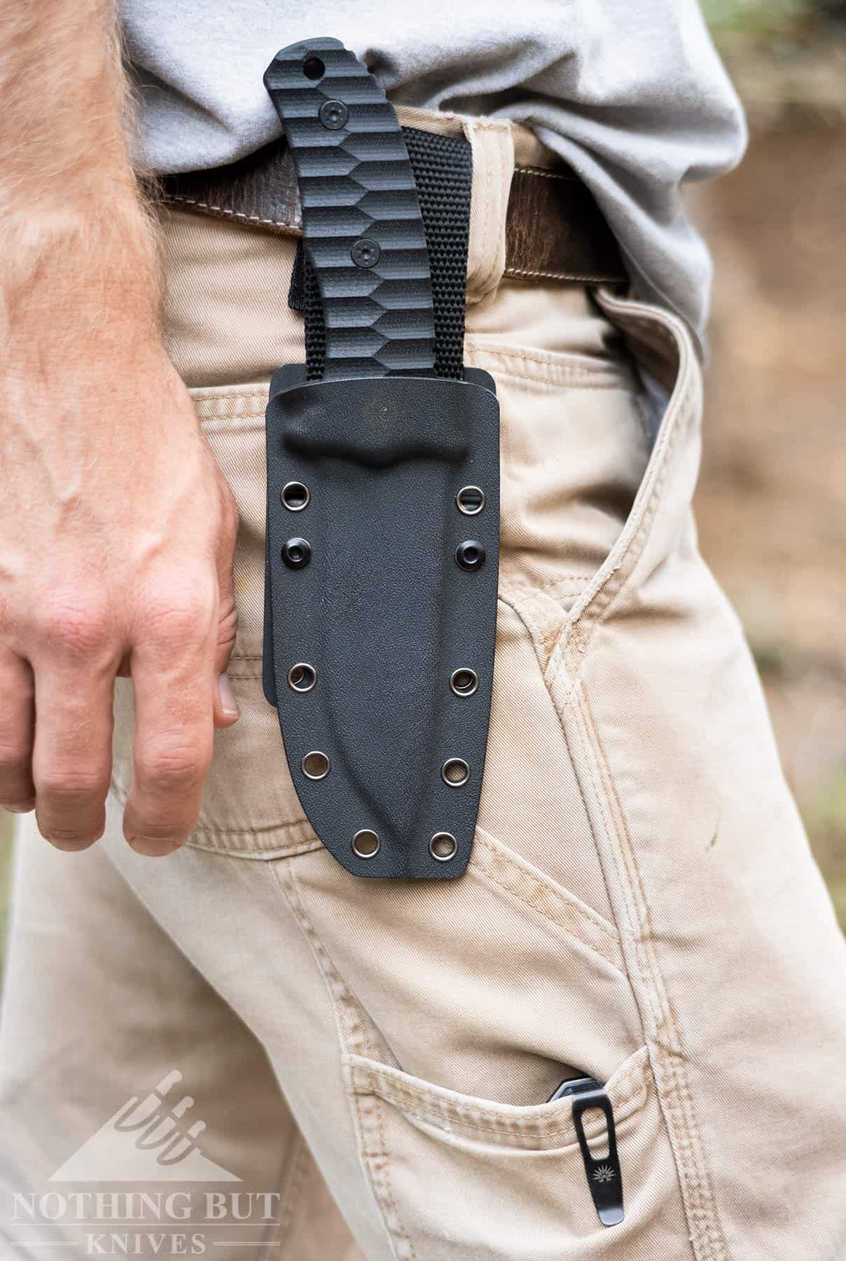 Off-Grid Backcountry Review - V2 Update 14 A person wearing the Off-Grid Backcountry fixed blade with the sheath extension add on.
