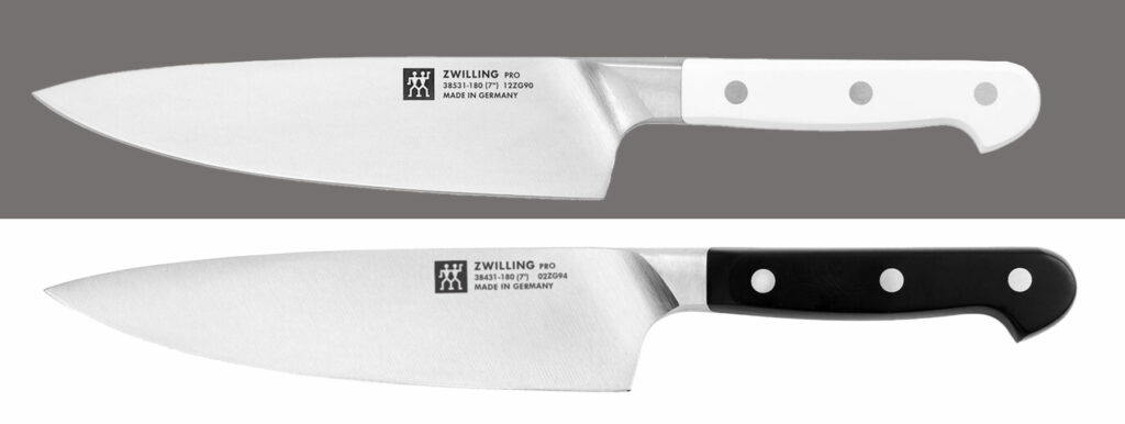 Two versions of the Zwilling Pro chef knife. The LeBlanc version is on the top and the black version is on the bottom. 