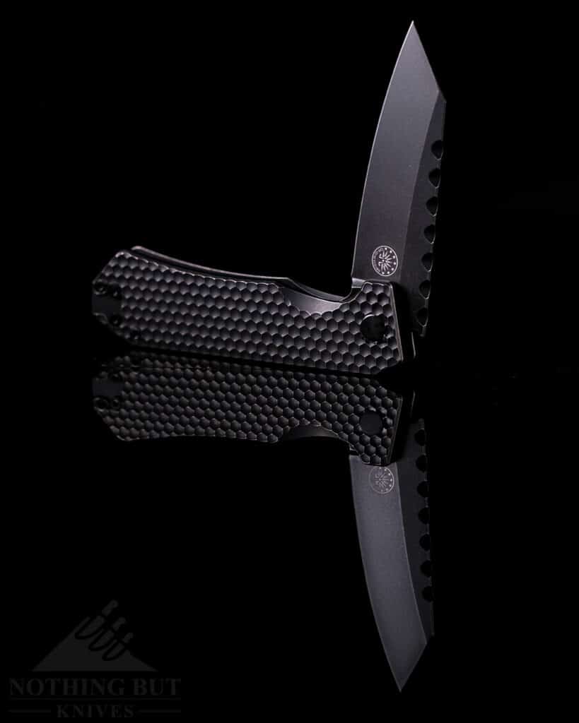 The Off-Grid Black Mamba Version 2 on a reflective black background.