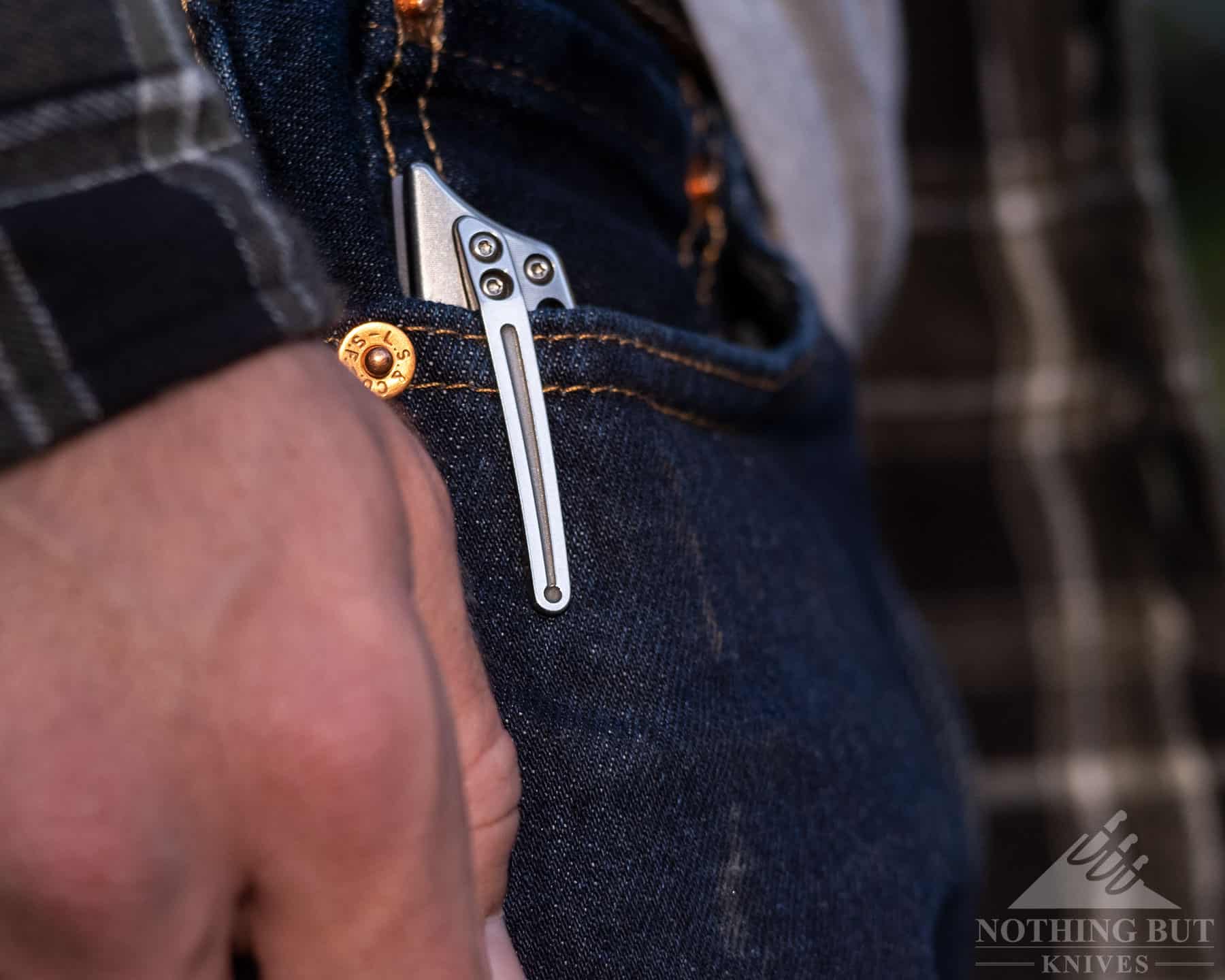 The Boker Plus HEA Hunter folding knife clipped into the pocket of a person's jeans. 