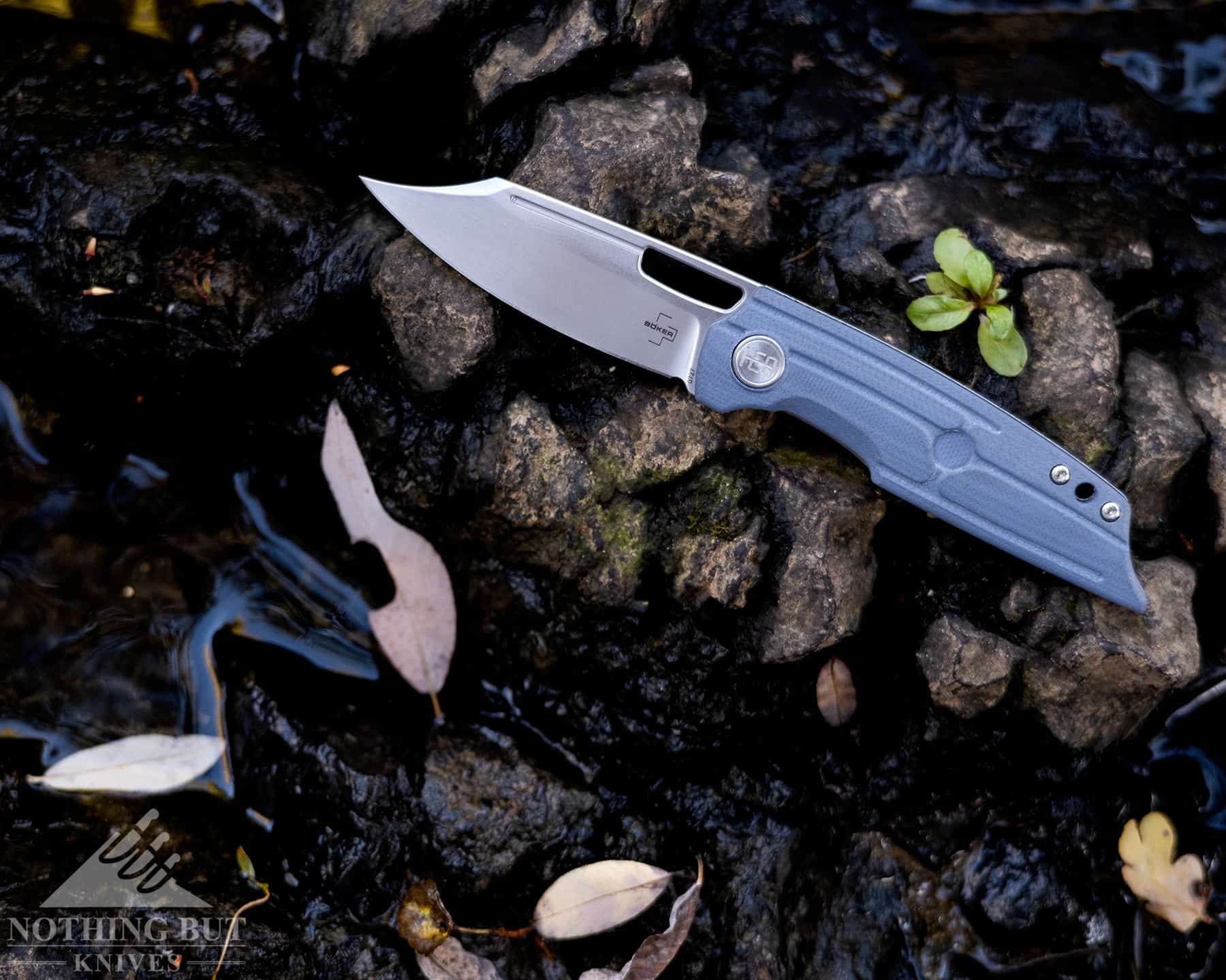Profile shot of the Boker Plus HEA Hunter front flipper folding knife that shows the unique blades design and handle contouring. 